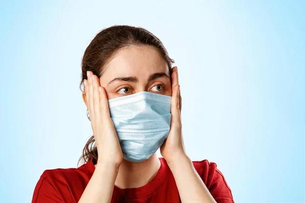 Portrait Brunette Woman Medical Mask Red Shirt Clutching Her Head — Stock Photo, Image