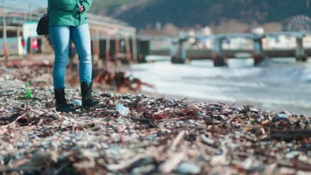 Woman Walks Muddy Beach Kicks Plastic Bottle Side Close Slow — Stock Video