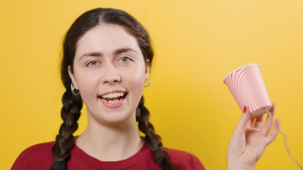 Smiling Woman Communicates Toy Walkie Talkie Made Out Paper Cup — Stock Video