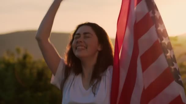 Young Happy Woman Singing Dancing Waves American Flag Background Sunset — Stock Video