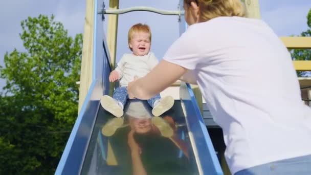 Mother Plays Her Whimsy Child Playground Teaches Baby Roll Children — Wideo stockowe