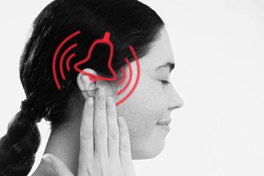Tinnitus. A dissatisfied young woman holds her hand over her ears, experiencing ringing and pain. The concept of ear diseases and deafness. clipart