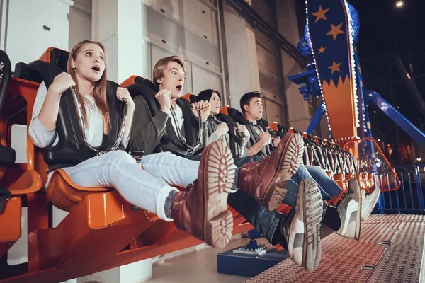 Frightened people while riding the attraction. — Stock Photo, Image