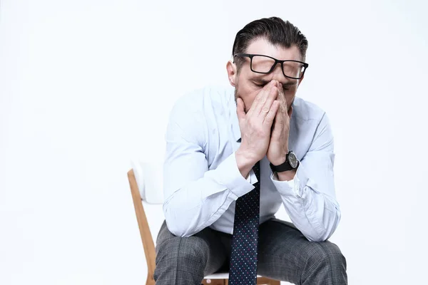 Man sits on chair and folded his arms from fatigue — Stock Image Man sits on chair and folded his arms from fatigue Royalty Free Stock Images