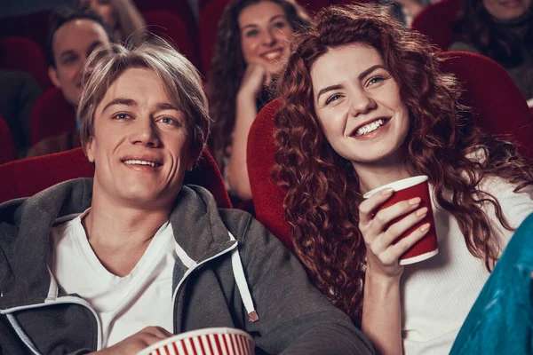 Close-ups of men and women watching a movie. — Stock Photo, Image