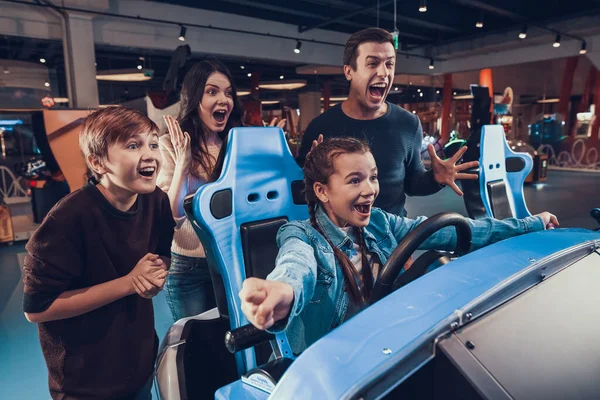 Girl is happy that she won the race in playroom. — Stock Photo, Image