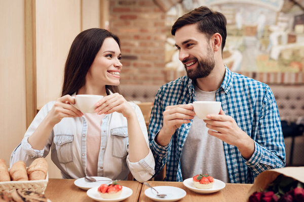 Happy Young Couple Have Date in Modern Cafeteria.