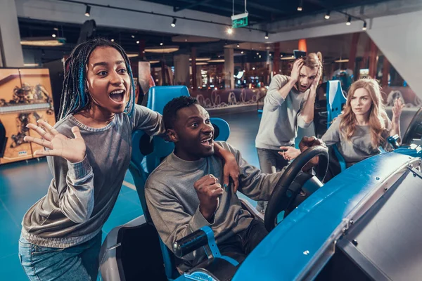 A guy and a girl are spending time with friends. — Stock Photo, Image