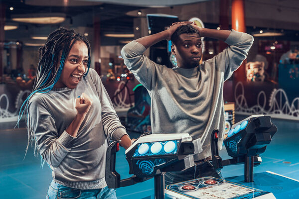 The girl is happy that she defeated the man. 