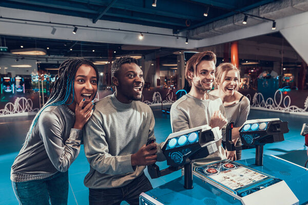 The man stand behind the playful jyotics and smile