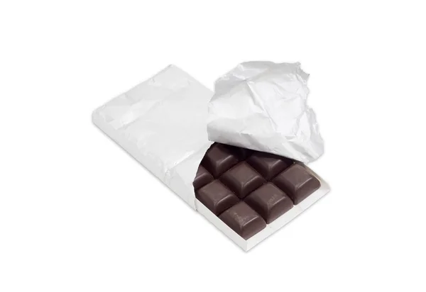 Dark chocolate in the opened packing on a light background — Φωτογραφία Αρχείου