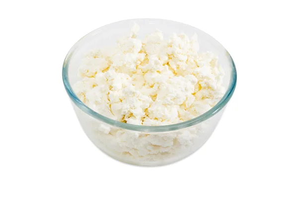 Cottage cheese in glass bowl on a light background — Stock Photo, Image