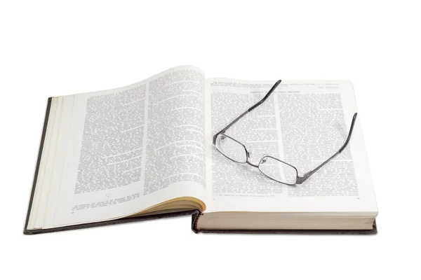 Modern eyeglasses on open book on a light background — Stock Photo, Image