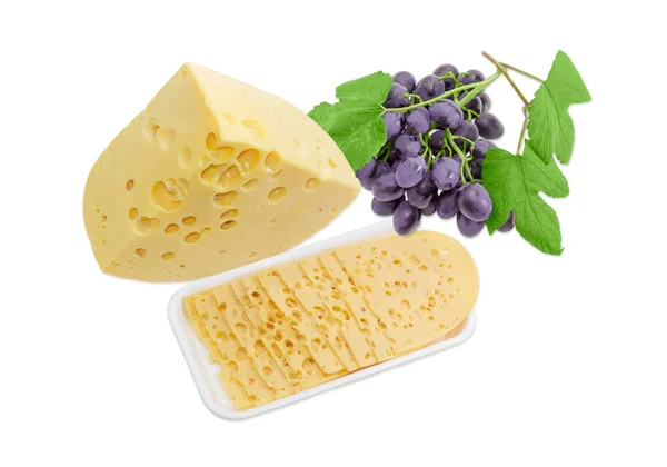 Een stuk, verschillende segmenten van Swiss-type kaas en druiven — Stockfoto