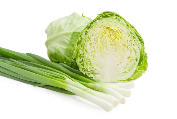 Heads of cabbage and green onion on a light background — Stock Photo, Image