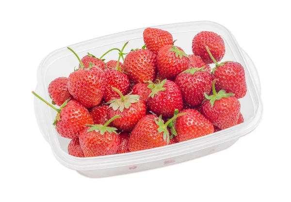 Garden strawberry fruits in the plastic tray on light background — Stock Photo, Image