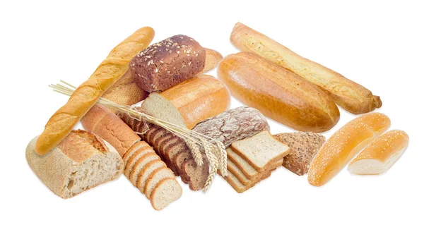 Różne rodzaje chleba i kilka pszenica uszy — Zdjęcie stockowe