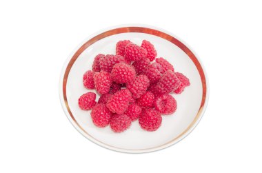 Daire üzerinde hafif bir arka plan üzerinde kırmızı ahududu meyveleri