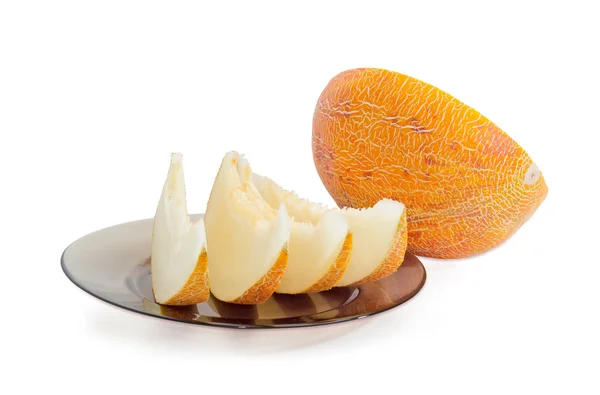 Several slices and half of melon on a light background — Stock Photo, Image