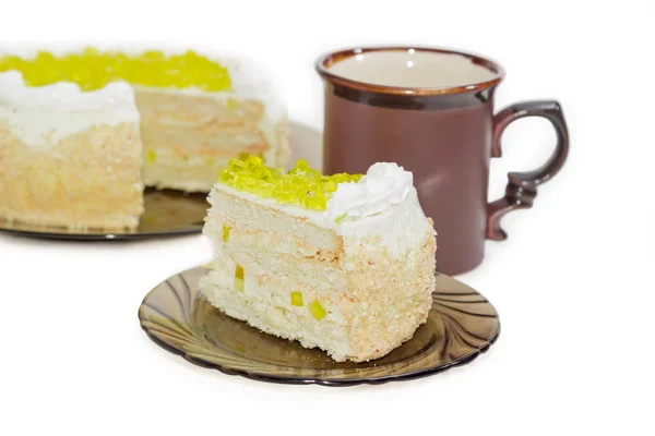 Layered cake with slices of lemon jelly on glass saucer — Stock Photo, Image