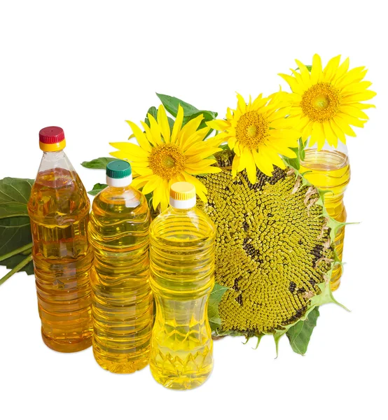 Mehrere Flaschen Sonnenblumenöl und Sonnenblumenblüten — Stockfoto