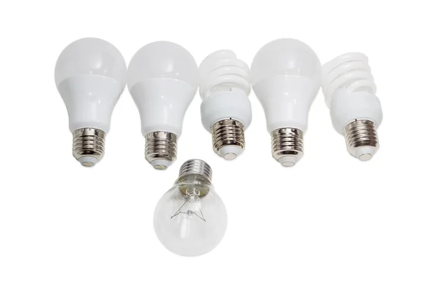 Glühlampe gegen mehrere moderne Energiesparlampen — Stockfoto