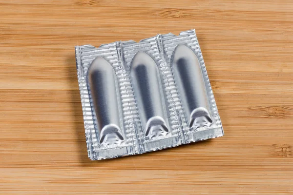 Foil Packaging Medical Preparations Form Suppositories Wooden Surface — Stock Photo, Image