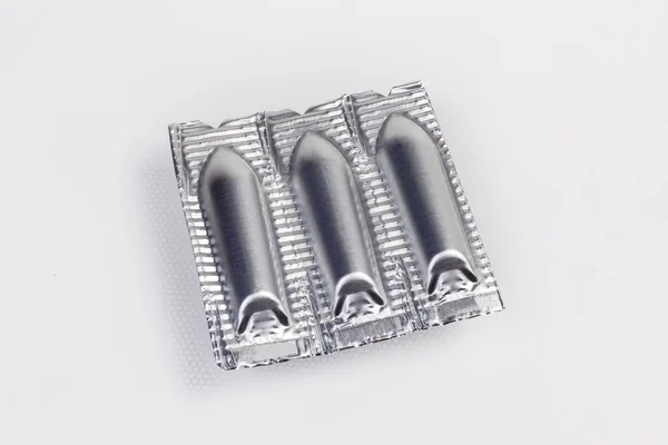 Folieverpakking Van Medische Preparaten Vorm Van Zetpillen Het Lichte Oppervlak — Stockfoto