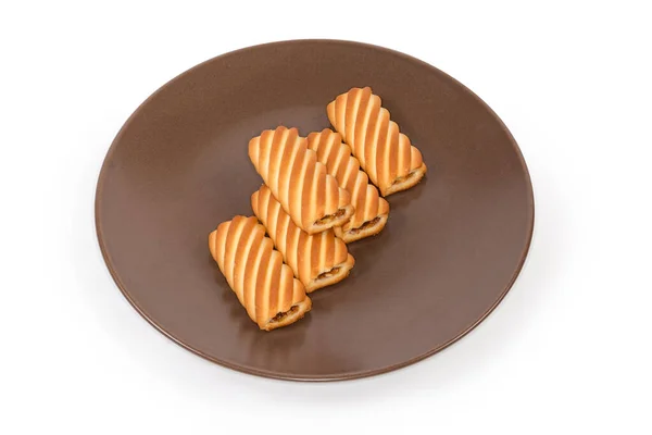 Kekse Form Von Geriffelten Röhrchen Mit Marmeladenfüllung Auf Braunem Teller — Stockfoto