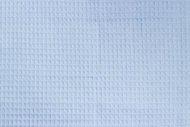 Açık mavi pamuklu waffle havlusunun dokusu yatay desenli, üst görünüm, arka plan