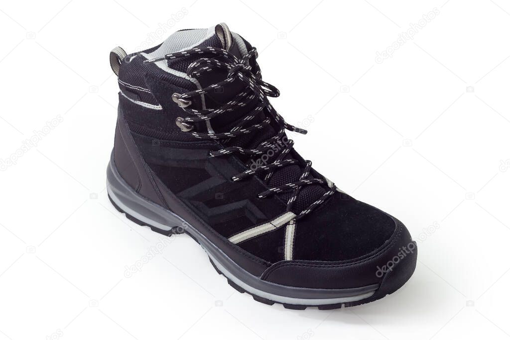 Single black trekking boot on a white background