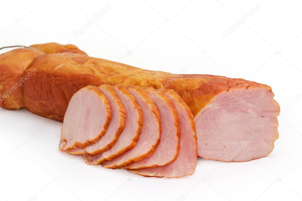Partly sliced piece of boiled-smoked pork loin on a white background, close-up in selective focus