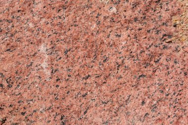 Büyük kırmızı granit bloğunun kenarları, dokusu, arkaplanı