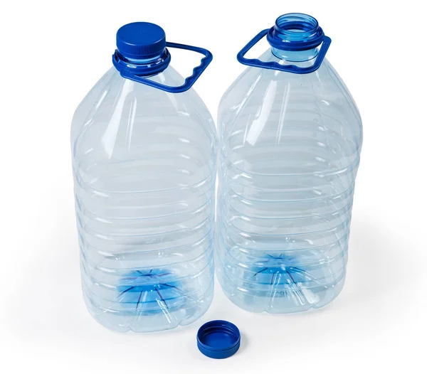 两只空的蓝色透明塑料瓶 用于喝水 瓶盖为螺丝 手柄为白色底座 — 图库照片