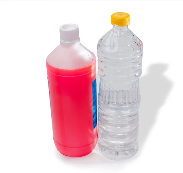 Bottles of antifreeze and water — Stock Photo, Image