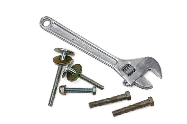 Adjustable wrench and bolts — Stock Photo, Image