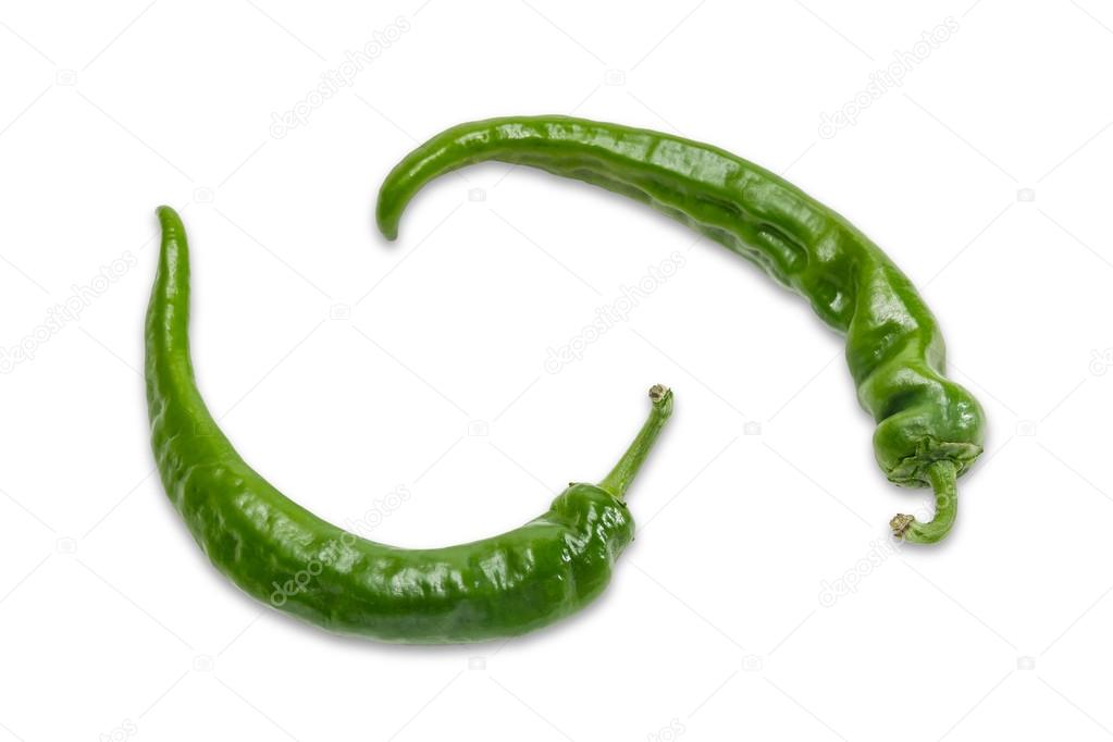 Two green pepper chili on a light background