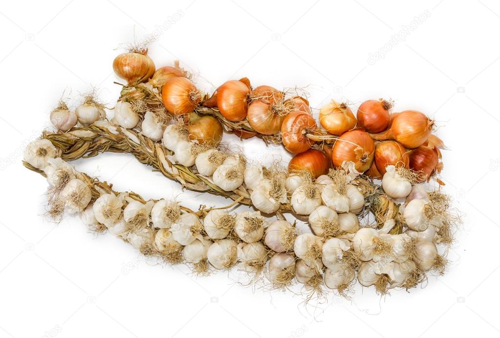 Bundle of onions and on garlic a light background