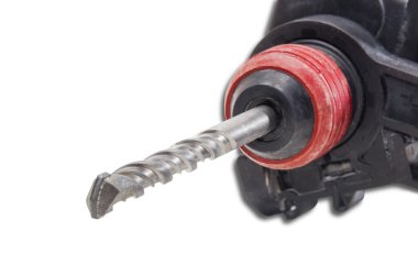 Masonry drill bit in a chuck of hammer drill closeup