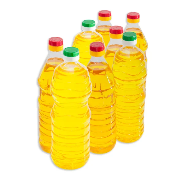 Several bottles of sunflower oil on a light background — Stock Photo, Image