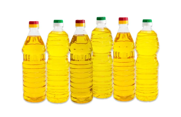 Several bottles of sunflower oil on a light background — Stock Photo, Image