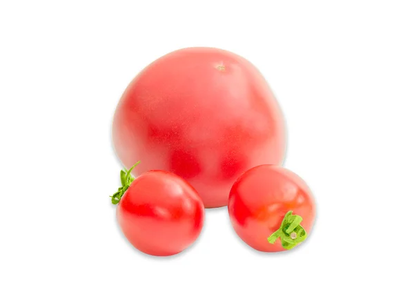 Drie rijpe rode tomaten verschillende maten close-up — Stockfoto