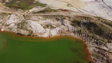 Waste rock dumps, artificial lakes in ilmenite quarry, aerial view