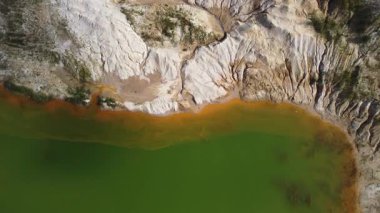 Waste rock dumps, artificial lakes in ilmenite quarry, aerial view
