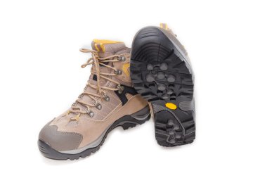 Light brown trekking shoes on a light background