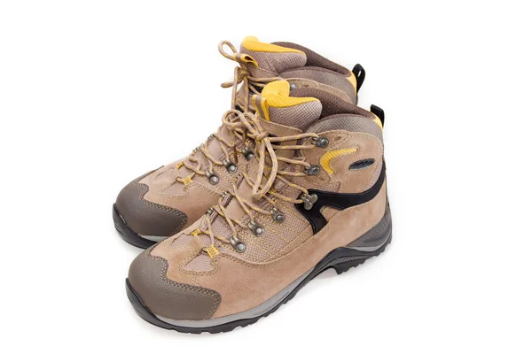 Sapatos de trekking marrom claro em um fundo leve — Fotografia de Stock
