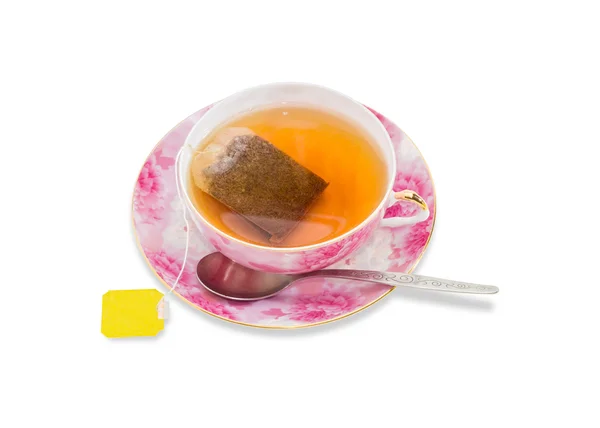 Taza de té con bolsa de té, cuchara en el platillo —  Fotos de Stock