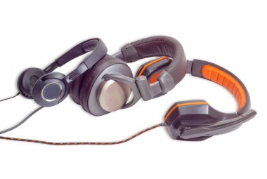 Three different pairs of headphones on a light background