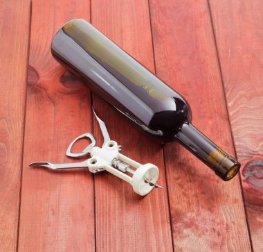 Wing corkscrew and a bottle of wine 