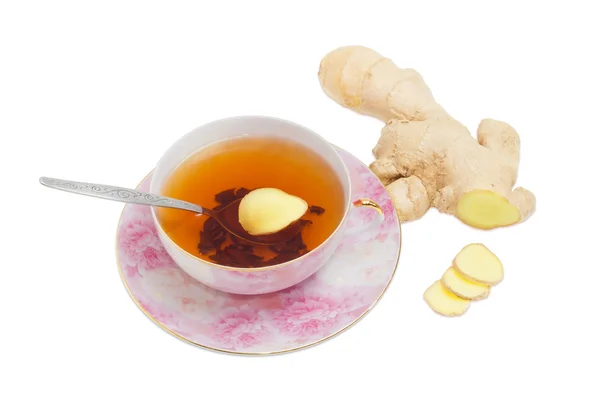 Ginger tea on a background of ginger root